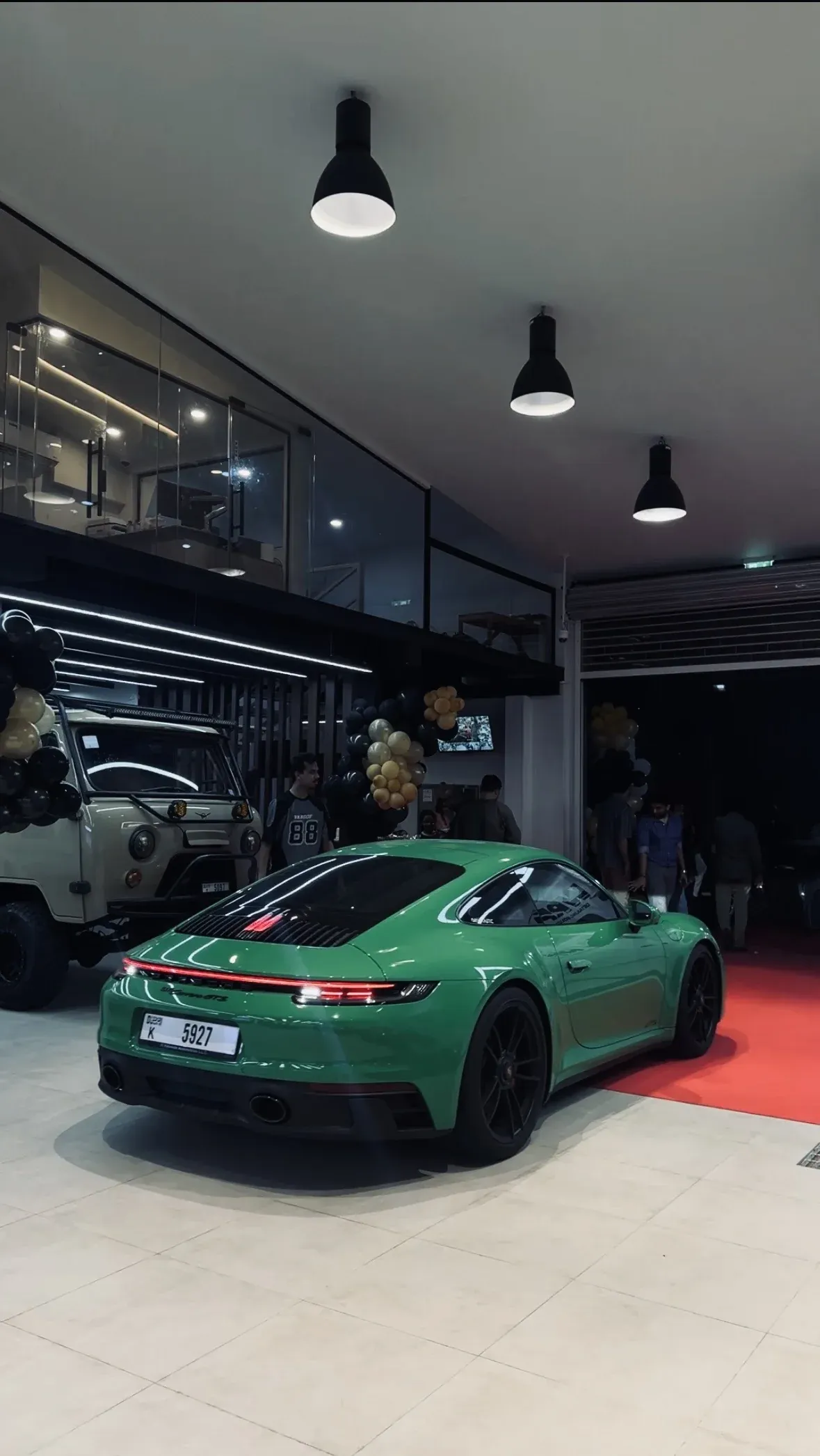 Green Porsche 911 showcasing mirror-finish paint correction and ceramic coating at WRP Detailing Studio