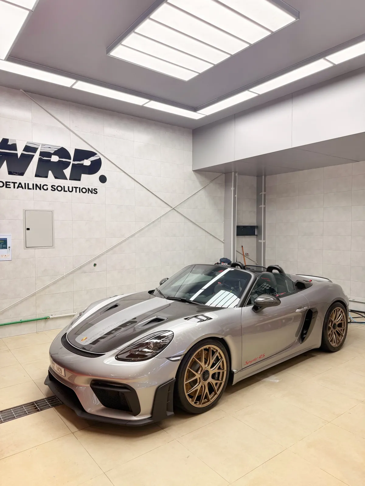 Porsche Boxster Spyder with paint protection film installation at WRP Detailing Studio showroom